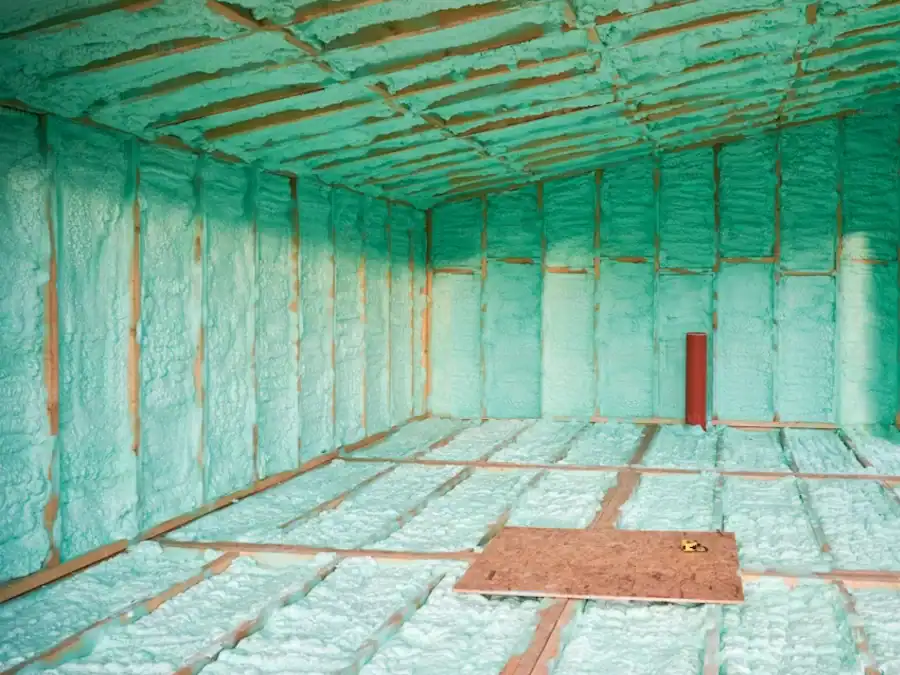An interior room that is bare, showing insulation