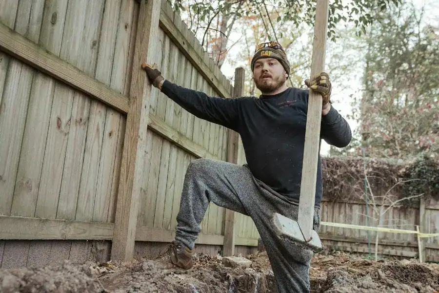 Construction worker preparing a residential concrete foundation