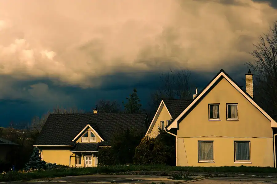 Dark storm clouds approaching homes during severe weather