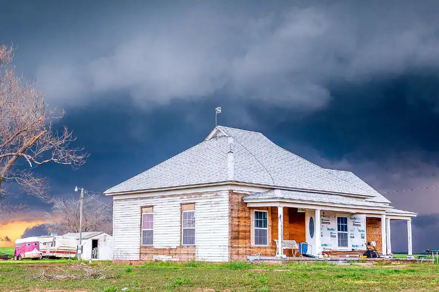 House under severe storm clouds on the Oklahoma prairie
