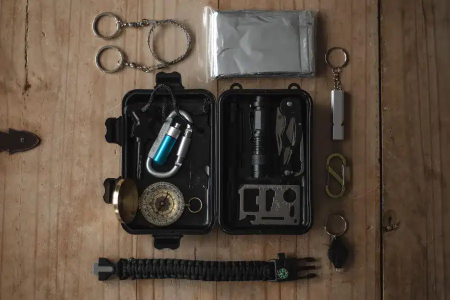 Organized storm shelter emergency kit with flashlight, blanket, and survival tools